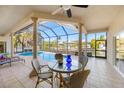 Enjoy waterfront views from this relaxing poolside dining area at 4937 Oxford Dr, Siesta Key, FL 34242