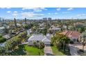 Aerial view of a canal-front home with a large backyard and lush landscaping at 5164 Windward Ave, Sarasota, FL 34242