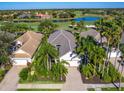 Bird's-eye view of houses near golf course and pond at 7131 Sandhills Pl, Lakewood Ranch, FL 34202