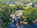 Housetop view of single story home with surrounding trees at 7705 Alhambra Dr, Bradenton, FL 34209
