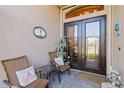 Relaxing front porch with wicker chairs and welcoming decor at 1111 Socorro Dr, Punta Gorda, FL 33950