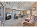 Living room with two armchairs, sofa, and TV at 1523 46Th E Ave, Ellenton, FL 34222
