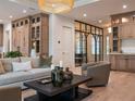 Open living area with light wood cabinets and a stylish modern coffee table at 2311 Grove St, Sarasota, FL 34239