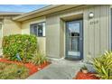 Front door entrance of a house with walkway and landscaping at 2709 60Th Avenue N Plz # D, Bradenton, FL 34207
