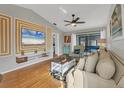 Spacious living room with hardwood floors, comfy seating, and large TV at 2709 60Th Avenue N Plz # D, Bradenton, FL 34207