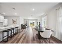 Open concept kitchen and dining area with an island and modern appliances at 3408 Hilltop Cir, Bradenton, FL 34211