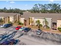 Exterior view of apartment building with parking at 3421 Clark Rd # 122, Sarasota, FL 34231