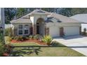 Curb appeal with 3-car garage and nicely landscaped yard at 3439 101St E Ave, Parrish, FL 34219