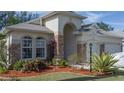 Landscaped front yard with stone accents and mature plants at 3439 101St E Ave, Parrish, FL 34219