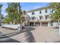 Beautiful home with a large driveway and mature landscaping at 4136 Roberts Point Cir, Sarasota, FL 34242