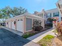 Three-car garage with white doors and decorative lattice at 4207 Caddie E Dr # 202, Bradenton, FL 34203