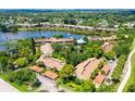 Wide aerial view of the condo community and its lush surroundings at 5369 Lake Arrowhead Trl # 17A, Sarasota, FL 34231