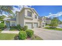 Front view of condo with landscaping and walkway at 5507 Fair Oaks St # 3-C, Bradenton, FL 34203