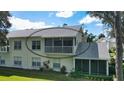 Back exterior view of condo with screened balcony at 5507 Fair Oaks St # 3-C, Bradenton, FL 34203