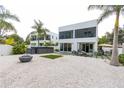 Large backyard with a spa, artificial turf, and fire pit at 5906 Larchwood Ave, Sarasota, FL 34231