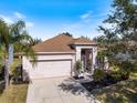 Single-story house with a large backyard and a view of a nearby lake at 6516 Rock Bridge Ln, Ellenton, FL 34222