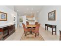 Casual dining area with a round table and four chairs, adjacent to kitchen at 7107 Cedar Hollow Cir, Bradenton, FL 34203