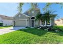 House exterior showcasing a charming front entrance and landscaping at 7825 112Th E Ave, Parrish, FL 34219