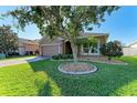 Attractive curb appeal with a spacious lawn and driveway at 7923 111Th E Ter, Parrish, FL 34219