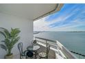 Spacious balcony with water view and seating for four at 888 Blvd Of The Arts # 1408, Sarasota, FL 34236