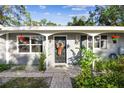 Inviting front entrance with wreath and brick walkway at 1100 27Th W Ave, Palmetto, FL 34221