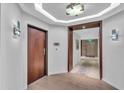Elegant hallway with hardwood floors and access to elevator at 1211 Gulf Of Mexico Dr # 403, Longboat Key, FL 34228