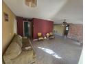 Living room with tiled floor, and two armchairs at 1346 Kenmore St, Port Charlotte, FL 33952