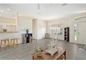 Open living area with hardwood floors and a view to kitchen at 1447 Allegheny Ln, North Port, FL 34286