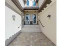 Inviting entryway with double doors and a brick-paved walkway at 17607 Gawthrop Dr # 103, Bradenton, FL 34211