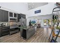 Modern kitchen with stainless steel appliances and granite countertops at 1790 Ezelle Ave, Largo, FL 33770