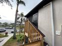 Wooden stairs leading to a condo building's rear entrance at 3750 59Th W Ave # 4096, Bradenton, FL 34210