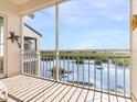 Screened balcony with scenic water views at 5440 Eagles Point Cir # 405, Sarasota, FL 34231