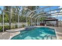 Inviting pool area with spa and screened enclosure at 5554 New Covington Dr, Sarasota, FL 34233