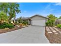 Single story home with a well manicured lawn and attached garage at 6706 22Nd W Ave, Bradenton, FL 34209