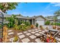 Landscaped front yard with stone path and lush greenery at 6706 22Nd W Ave, Bradenton, FL 34209