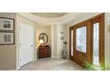 Bright entryway with tiled floor and wood door at 7121 Victoria Cir, University Park, FL 34201