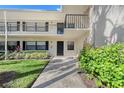 Condo building exterior with walkway and landscaping at 7130 Fairway Bend Ln # 193, Sarasota, FL 34243