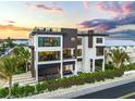 Modern coastal home featuring a rooftop deck and pool at 101 7Th S St, Bradenton Beach, FL 34217