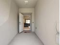 Inviting entryway with open door view into the main living area at 14350 Easy Goer St, Ruskin, FL 33573