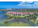 Aerial view of community with waterfront access at 1626 Stickney Point Rd # 26-102, Sarasota, FL 34231