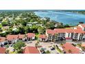 Aerial view highlighting a condo unit near the water at 1626 Stickney Point Rd # 26-102, Sarasota, FL 34231