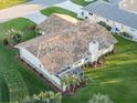 Aerial view of house, highlighting the backyard and patio at 1726 Killdeer Cir, Venice, FL 34293