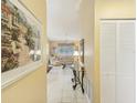 View of condo living area from entryway, showing tiled floor and living room furniture at 3001 Seawind Cir # 10C, Venice, FL 34293