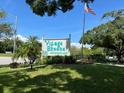 Village Brooke Condominiums sign with landscaping at 3231 Beneva Rd # 103, Sarasota, FL 34232