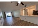 Bright living room with vinyl flooring and kitchen bar at 3231 Beneva Rd # 103, Sarasota, FL 34232