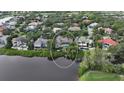 Wide aerial view of a luxury home on the waterfront, nestled in a community at 3310 Sabal Cove Ln, Longboat Key, FL 34228