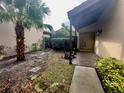 Inviting front entry with a paved walkway and a small garden at 3725 Glen Oaks Manor Dr, Sarasota, FL 34232