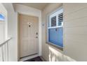 Condo entry with beige door and window at 431 Cerromar Ln # 446, Venice, FL 34293
