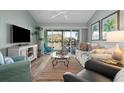 Living room with comfy seating and golf course view at 431 Cerromar Ln # 446, Venice, FL 34293
