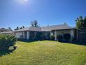 Ranch-style home with a spacious yard and mature landscaping at 5320 Fox Run Rd, Sarasota, FL 34231